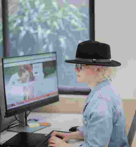 A person sitting at their desk.